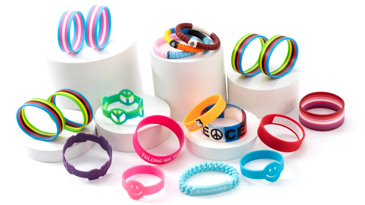 A collection of colorful custom silicone wristbands showcasing various designs and messages.